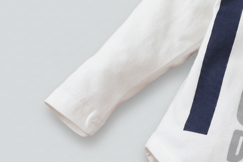 Close-up of a white shirt with a blue stripe on a white background