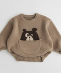 Beige sweater with a bear design on a white background