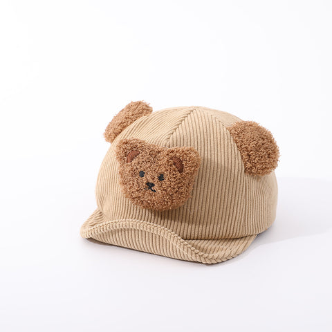 Beige baby hat with bear face and ears on a white background