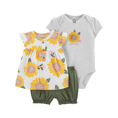 Baby outfit set with floral dress, gray onesie, and green shorts on a white background