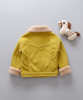 Yellow children's jacket with pink cuffs and collar on a light gray background