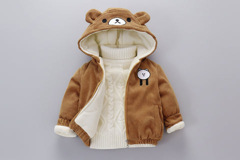 brown jacket with bear ears and face on a gray surface