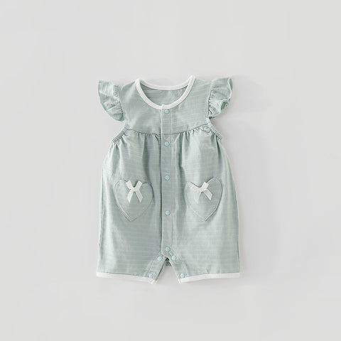Light green baby romper with heart designs on a light gray background