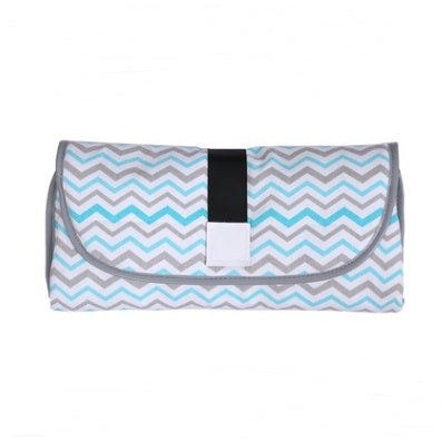 Foldable mat with blue and gray chevron pattern on a white background