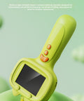 Green toy with screen and buttons on a green background