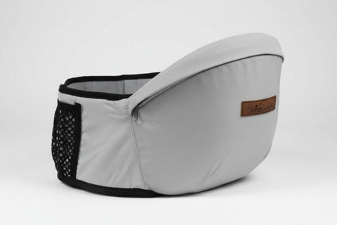 Gray baby carrier with black mesh and brown label on a white background