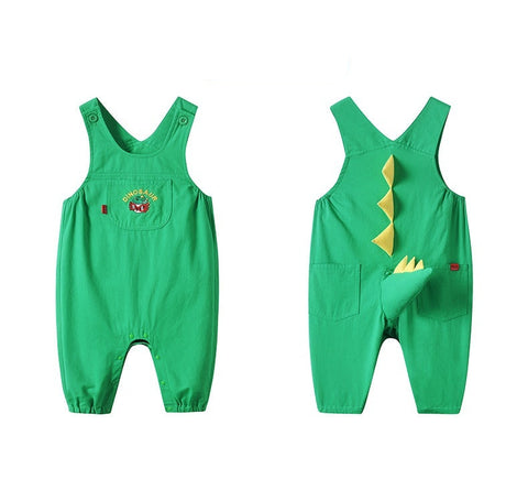 Green children's overalls with dinosaur design on a white background