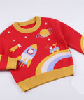Red children's sweater with space-themed graphics on a light gray background