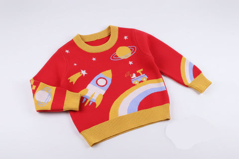 Red children's sweater with space-themed graphics on a light gray background