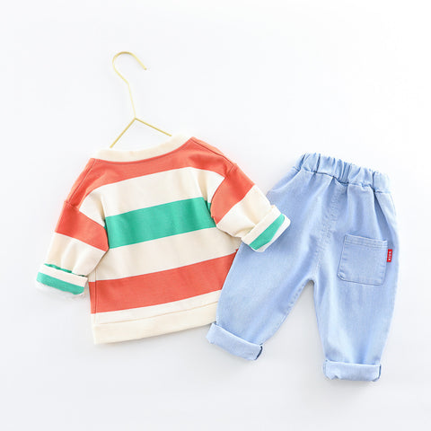 Children's striped shirt and blue jeans on a white background