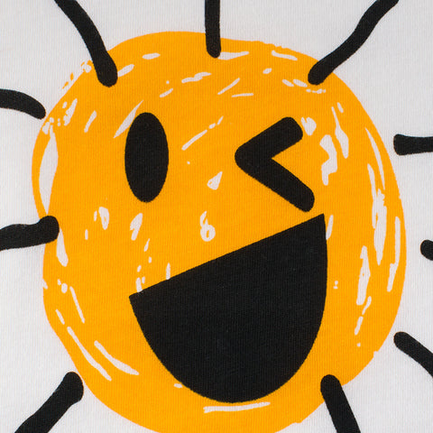 Illustration of a smiling face with a yellow circle, black mouth, and black lines for hair on a white background.