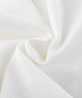 Close-up of white fabric with a textured pattern