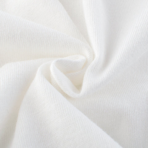 Close-up of white fabric with a textured pattern
