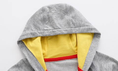 Chaqueta con capucha de dinosaurio juguetón