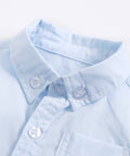 Light blue shirt with collar and buttons on a white background