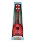 Red toy guitar with packaging on a white background