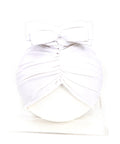 White dress with a bow detail on a white background