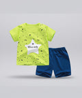 Children's outfit with a bright green shirt and blue shorts on a white background