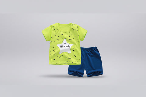 Children's outfit with a bright green shirt and blue shorts on a white background