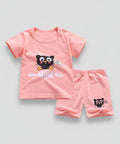 Pink children's t-shirt and shorts set with a cartoon cat design on a white background