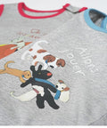 Two children's shirts with cartoon dog designs and text on a white background