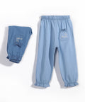Blue denim pants with a pocket on a white background