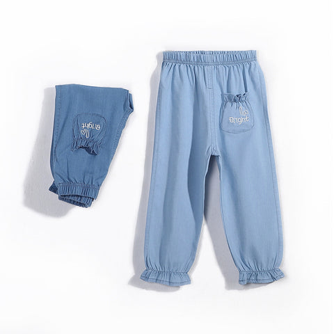 Blue denim pants with a pocket on a white background