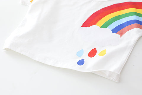 White fabric with a colorful rainbow and cloud design on a light gray background