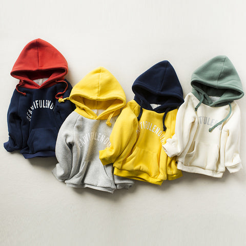 Five colorful hoodies arranged in a row on a light background