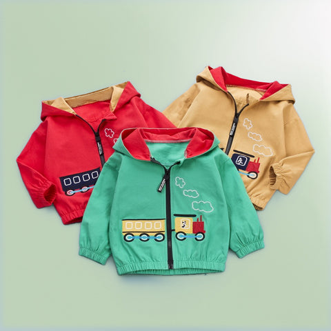 Three children's hoodies in red, green, and beige on a light green background