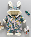 Floral baby snowsuit with bunny ears, baby shoes, and booties on a gray background