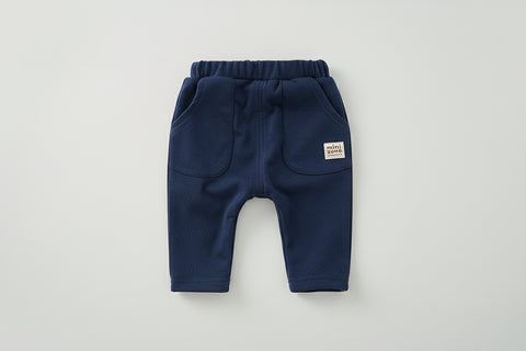 Navy blue baby pants with a visible brand label on a white background