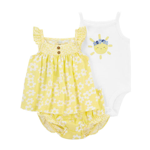 Baby outfit with yellow floral dress and white shirt on a white background