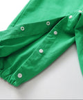 Green pants with buttons on a white background