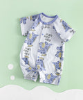Baby romper with dinosaur pattern on a light green background