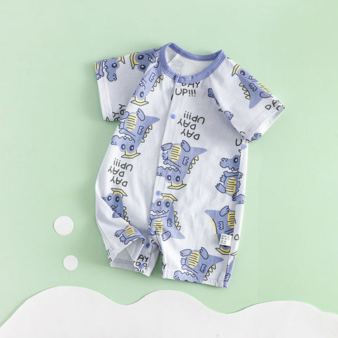 Baby romper with dinosaur pattern on a light green background