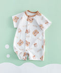Baby romper with bear pattern on a light green background