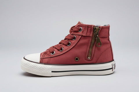 Red high-top sneaker with a white sole on a white background