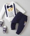 Baby outfit set with white onesie, navy pants, and shoes on a white background