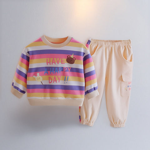 Children's colorful striped sweatshirt and beige pants with text on a light gray background