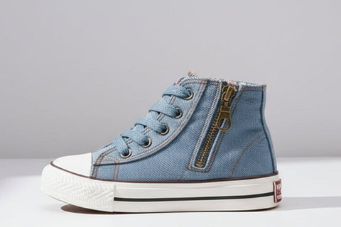 Blue high-top sneaker with a zipper on a white background