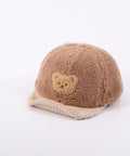 Brown fleece-lined cap with a bear patch on a white background