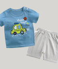 Children's blue t-shirt with a yellow car graphic and white shorts on a white background