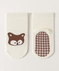 Baby socks with a fox design and textured sole on a white background