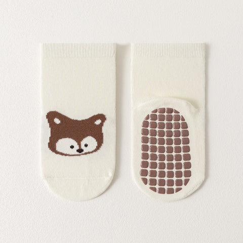 Baby socks with a fox design and textured sole on a white background