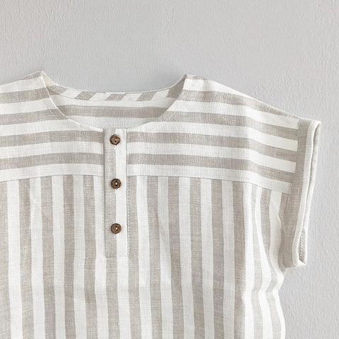 Striped shirt with buttons on a light gray background