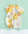 Baby romper with duck pattern on a light green background