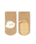 Pair of beige socks with a cartoon chick design on a white background