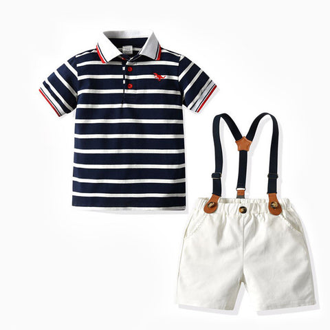 Children's outfit with striped polo shirt and white shorts with suspenders on a white background