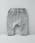 Gray baby pants with a brand label 